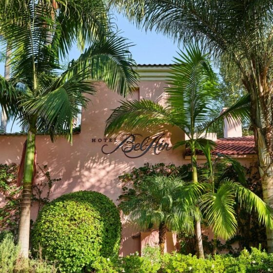 Hotel Bel Air front sign framed by exotic greenery